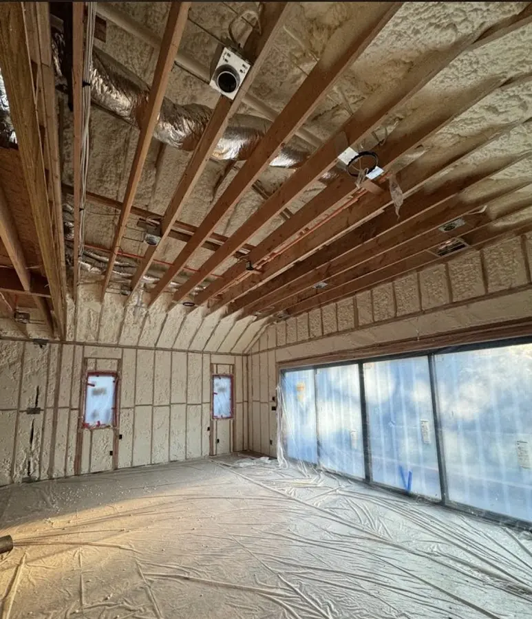 Interior walls and ceiling insulated with spray foam during new construction in Batavia